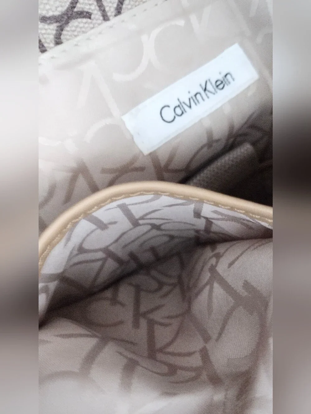 Calvin Klein Monogram Drawstring Backpack in Beige and Brown